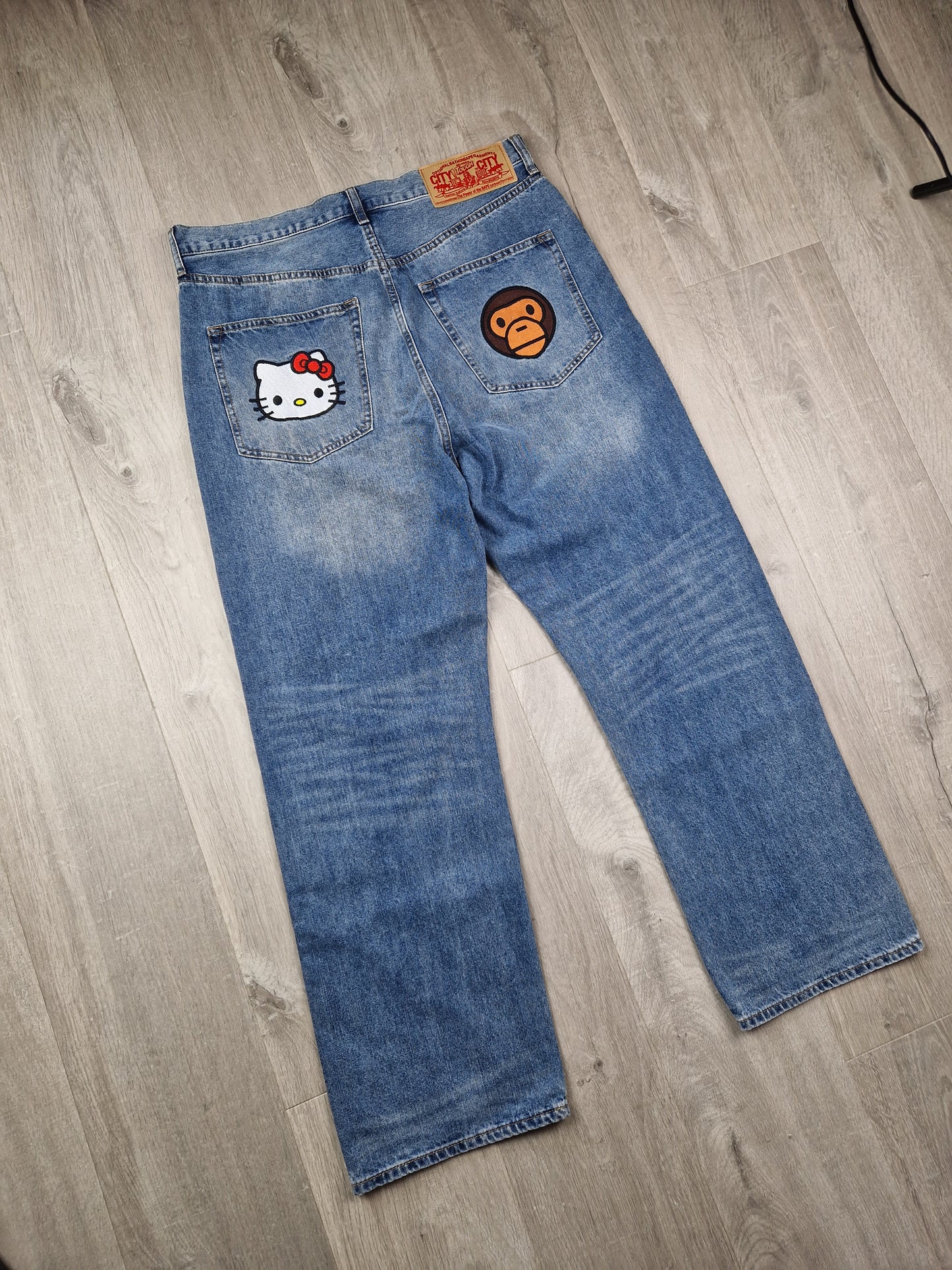 SuperRARE Bape x Sanrio Hello Kitty x Baby milo jeans (34×34)